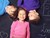 Tre børn der ligger på ryggen og smiler fra AMO Toys B2B digitale ehandelskanal